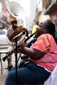 woman performing on road during daytime thumbnail