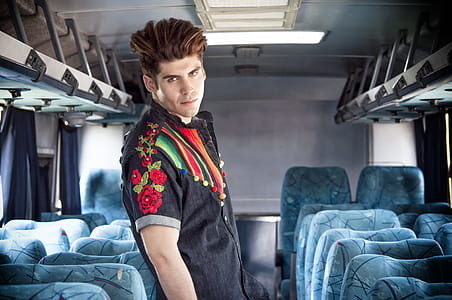Man Standing Between Passenger Seats thumbnail