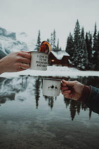 two person tossing mugs with winter background thumbnail