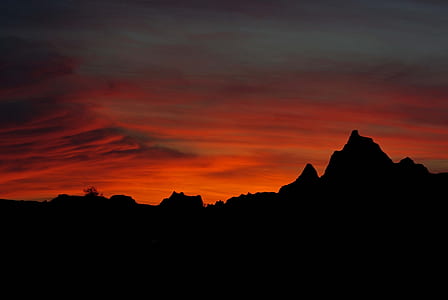 Silhouette Photo of Mountains during Golden Hour thumbnail
