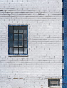 white painted wall with black metal framed clear glass mirror thumbnail