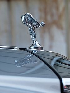 silver Rolls Royce vehicle hood ornament during daytime thumbnail