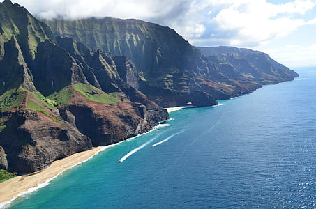 mountain beside body of water thumbnail