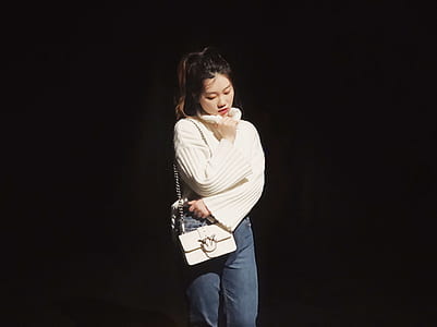 woman standing while wearing white leather crossbody bag thumbnail