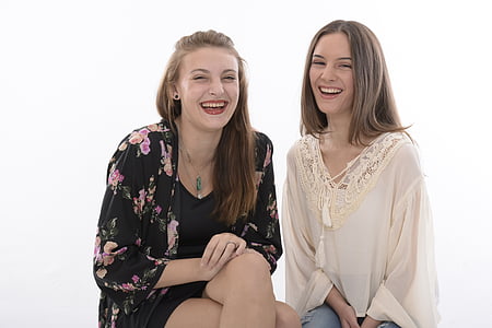 two women wearing black and white long-sleeved dresses thumbnail