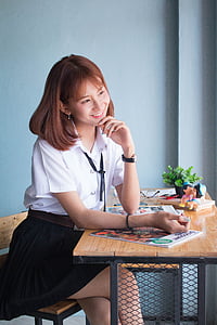 woman sitting on chair while smiling thumbnail