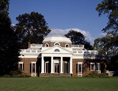 white and brown brick house at daytime thumbnail