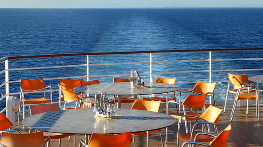 tables and chairs on boat dock thumbnail