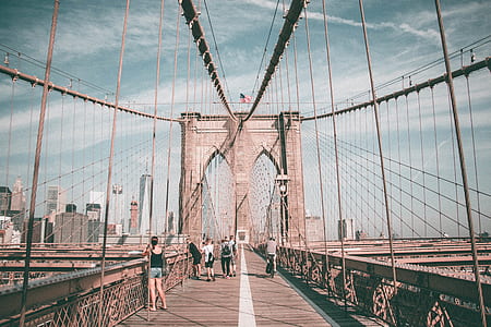 people walking on Brooklyn Bridge at daytime thumbnail