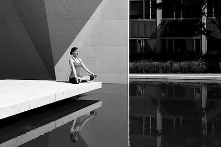 grayscale photo of woman in lotus position thumbnail