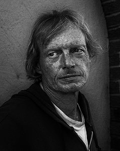 grayscale photo of man in black zip-up top thumbnail