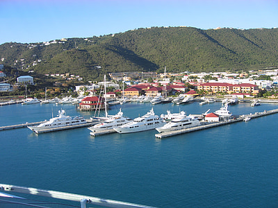 white yachts on sea near buildings at daytime thumbnail