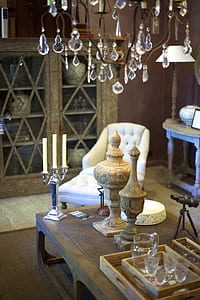 two brown vases on table near tufted white chair thumbnail