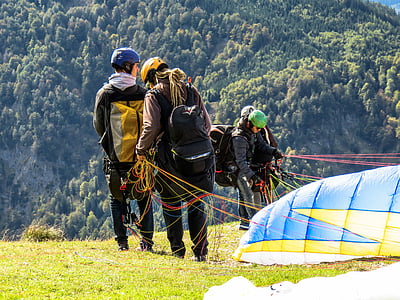 four person doing parachute during daytime thumbnail