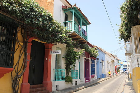 people walking beside houses thumbnail
