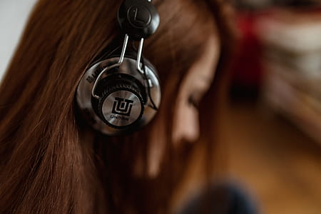 Beautiful young woman in headphones listening to music thumbnail