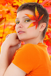 person with maple leaf on her ear thumbnail