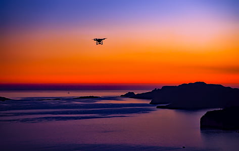 black RC quadcopter photo during sunset thumbnail