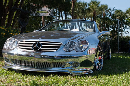 silver Mercedes-Benz convertible coupe parked besides trees at daytime thumbnail