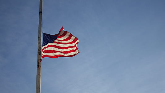 American Flag on white steel flag pole thumbnail