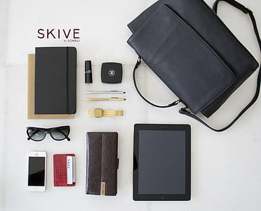 high-angle photography of devices and pouches thumbnail