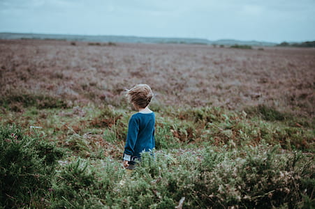 girl standing in the middle of meadows thumbnail