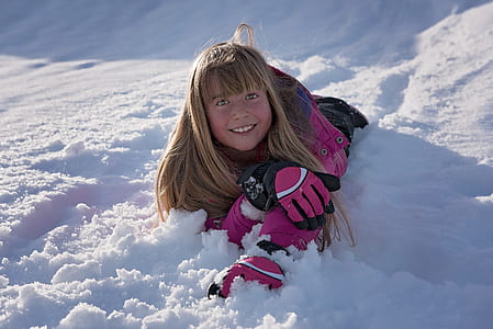 girl lying on the snow field thumbnail