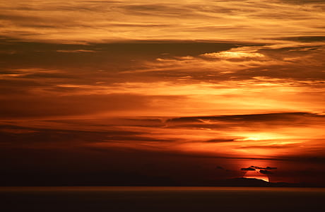silhouette of island during golden hour thumbnail