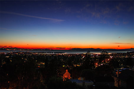 aerial photography of city at dusk thumbnail