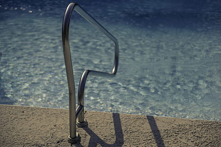 silver rail beside inground pool thumbnail