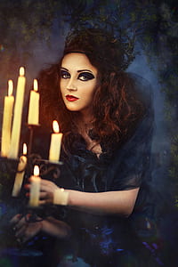 portrait painting a woman wearing black dress holding candle holder thumbnail