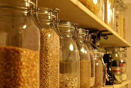 jars filled with nuts and beans on shelf thumbnail