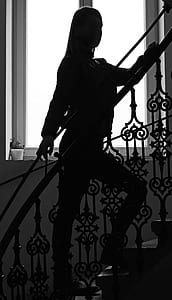 woman standing on staircase thumbnail