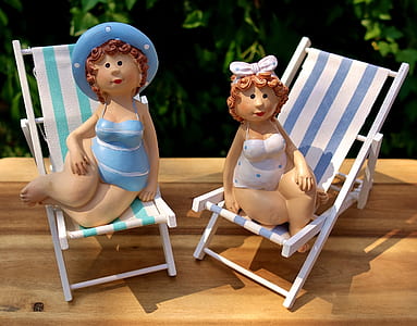 two woman dolls on lounge chairs thumbnail