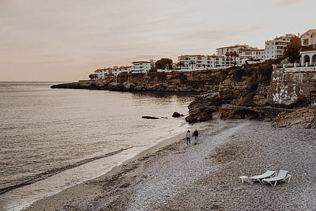 Two Person Walking on Seashore thumbnail