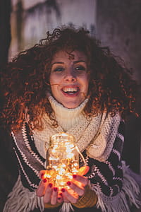 Woman Holding a Jar With String Lights thumbnail