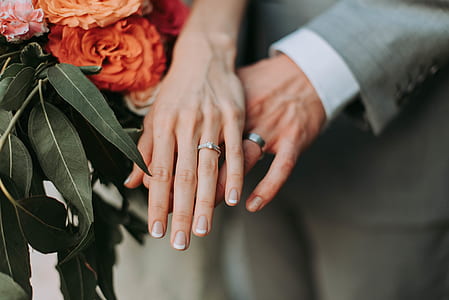 two hands wearing rings thumbnail