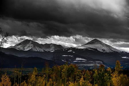 landscape photo of gray mountains under black sky thumbnail