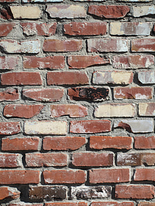 red and grey brick walls during day thumbnail