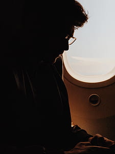 man beside plane window thumbnail
