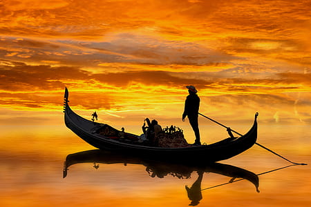 man riding canoe boat on body of water thumbnail