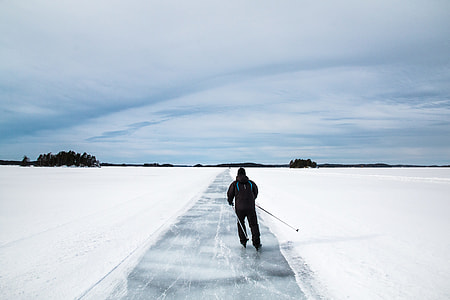 man skiing on snow covered ground thumbnail