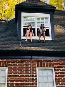 two girl on balcony window thumbnail
