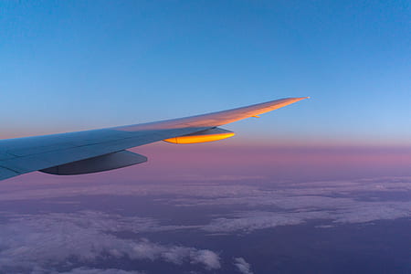 airplane above the cloud during daytime thumbnail