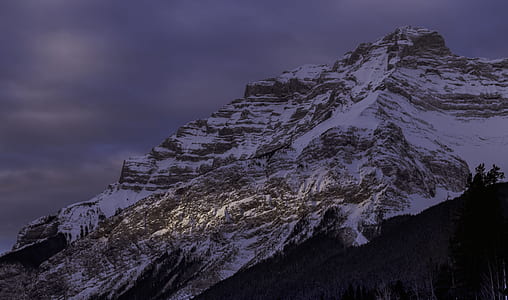 snow covered mountain during nighttime thumbnail