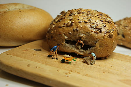 bread and miniature people figurine thumbnail
