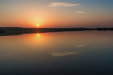 body of water during golden hour thumbnail