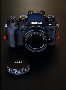 black Fujifilm X-TI camera near camera lens lid thumbnail