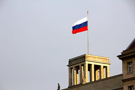 France flag on gray concrete building at daytime thumbnail