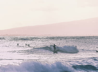 man surfing during golden hour thumbnail